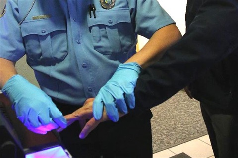 police aide fingerprinting other person